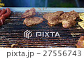 Rotate meat on a barbecue grill 27556743