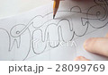 Designer drawing letters with pencil 28099769