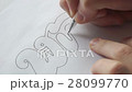 Designer trace the letters with pen 28099770