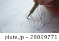 Designer drawing letters with marker 28099771