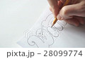 Designer drawing letters with pencil 28099774