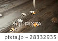puzzle parts falling on dark table 28332935