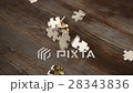 puzzle parts falling on dark table 28343836