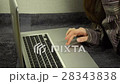 Close up of female hands using laptop lying on the 28343838