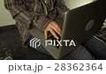 Close up of female hands using laptop sitting down 28362364