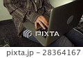Close up of female hands using laptop sitting down 28364167