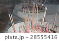 Close up of burning incense sticks. 28555416