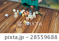 Dices Fall On a Wooden Table From Bag 28559688
