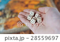 Several Rolling Dices Fall On a Table With 28559697