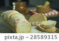 Cut slice of bread in slow motion, close up 28589315