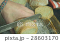 Cut slice of bread in slow motion, close up 28603170