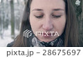 Woman Drinking Hot Drink in Winter Among Woods. 28675697