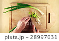 Finishing chopping bunch onion on wooden board 28997631