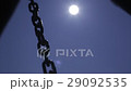Chain swinging in the wind on sky and sun 29092535