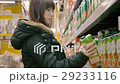Woman chooses juice in the supermarket 29233116