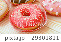 Frosted donuts with colorful sprinkles 29301811