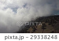 Aerial of mountain bikers on mountain in the fog 29338248
