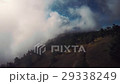 Aerial of mountain bikers on mountain in the fog 29338249