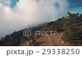 Aerial of mountain bikers on mountain in the fog 29338250