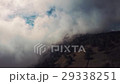 Aerial of mountain bikers on mountain in the fog 29338251