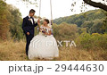 Groom is swinging his beautiful bride in white 29444630