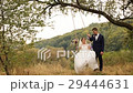 Groom is swinging her beautiful bride in white 29444631