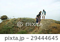 Two couples walking on the beach. 29444645