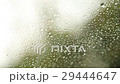 Rain drops on the window on rainy day. Green 29444647