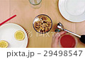 Longer pouring honey over walnuts into the blender 29498547
