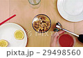 Pouring honey over walnuts into the blender for a 29498560