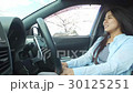 Young lady driving cherry blossom trees 30125251
