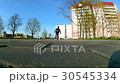 boy learns to ride a skateboard 30545334