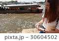 thai adult women philanthropy give food fish 30604502
