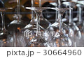 Shot of glasses hanging in a bar with focus transi 30664960