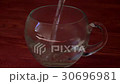 Pouring boiled water in transparent mug 30696981