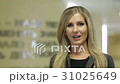 Businesswoman talking to camera  31025649