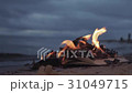 Burning book on the sand at coast storm clouds on 31049715
