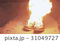 Burning boots on the sand at coast strong bright 31049727