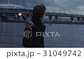 Young man clutching in hand burning bottle with 31049742