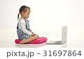 Little girl types the text on the keyboard. White 31697864