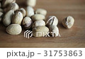 Pistachio nuts falling on the wood background 31753863