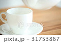 Pouring Tea to the cup on the wood background 31753867
