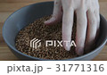 Female hands pours buckwheat grain, eco food 31771316