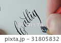 Calligrapher writing a word 31805832