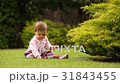 Cute baby girl crawling and playing in the green 31843455