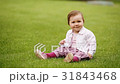 Little beautiful pretty baby-girl sitting on the 31843468