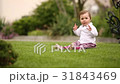 Little beautiful pretty baby-girl sitting on the 31843469
