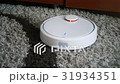 robotic vacuum cleaner on carpet - technology 31934351