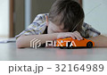 sad little boy lying on the floor at home 32164989