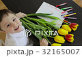 Happy little boy makes a holiday card for his mom  32165007